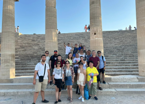 Some of the 2024 Cohort of the Rhodes Academy at the Acropolis in Lindos, Greece.